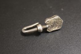 AN ANTIQUE HALLMARKED SILVER NAPKIN CLIP