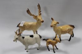 A BESWICK DEER TRIO TOGETHER WITH A MODEL OF A GOAT (4)