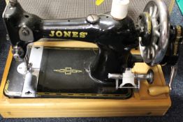 A CASE VINTAGE JONES SEWING MACHINE