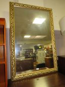 A MODERN GILT RECTANGULAR WALL MIRROR