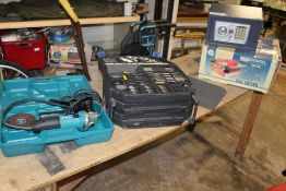 A MAKITA DISK CUTTER/ GRINDER A TABLE TOP SAW, A DIGITAL SAFE AND A DRILL BIT KIT