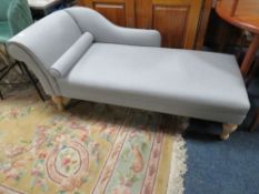 A MODERN CHAISE LONGUE