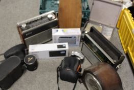 A COLLECTION OF VINTAGE PORTABLE RADIOS , CAMERAS, CLOCKS, ETC