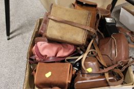 A TRAY OF VINTAGE CASED CAMERAS AND EQUIPMENT ETC