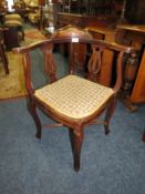 AN EDWARDIAN INLAID CORNER CHAIR