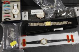 A BAG OF ASSORTED MODERN WRISTWATCHES