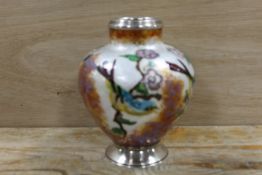 AN ORNATE ENAMEL STYLE VASE