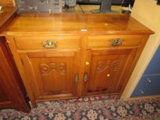 A CARVED MAHOGANY SIDEBOARD