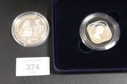 SILVER PROOF £1 AND £5 COINS