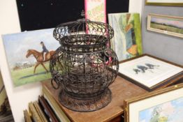 A LARGE ORNATE WIRE WORK SIX BOTTLE DECORATIVE WINE STORE