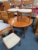 A RETRO STYLE DINING TABLE AND FOUR CHAIRS