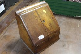 A VINTAGE OAK LETTER STAND