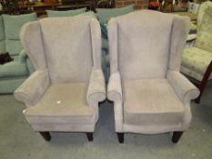 A PAIR OF MODERN WING BACK ARMCHAIRS