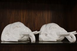A PAIR OF UNUSUAL WHITE GLOSS CERAMIC WALL MOUNTING ELEPHANTS STANDS