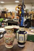TWO LARGE ORIENTAL STYLE VASES ONE CONTAINING UMBRELLAS AND WALKING STICKS
