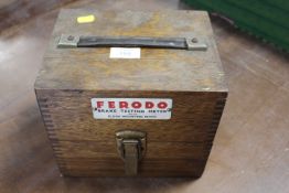 A CASED FERODO BRAKE TESTING METER WITH MOUNTING BLOCK