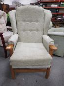 A MODERN WING BACK ARMCHAIR