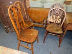 AN OAK DROPLEAF TABLE TOGETHER WITH FOUR ASSORTED CHAIRS