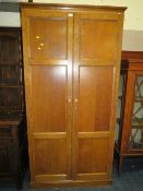A LARGE TWO DOOR VINTAGE OAK FITTED CUPBOARD - W 103 cm