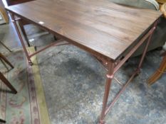 A MODERN INDUSTRIAL STYLE TABLE WITH CASTORS