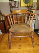 AN ANTIQUE ELM SMOKERS BOW ARMCHAIR