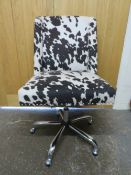 A MODERN SWIVEL CHAIR