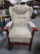 A MODERN WING BACK ARMCHAIR