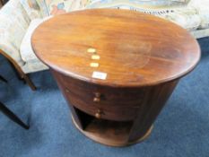 A MODERN OVAL HARDWOOD TABLE / CHEST