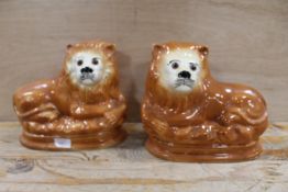 A PAIR OF VINTAGE STAFFORDSHIRE LIONS