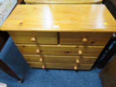 A HONEY PINE FIVE DRAWER CHEST