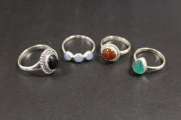 A COLLECTION OF 4 SILVER GEMSTONE DRESS RINGS TO INCLUDE AMETHYST, OPAL, ETC