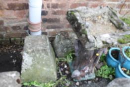 A CONCRETE BIRD BATH TOGETHER WITH TWO CONCRETE POSTS