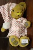 A MERRYTHOUGHT TEDDY BEAR IN SPOTTY NIGHTSHIRT AND HAT
