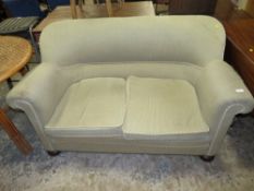 A VINTAGE UPHOLSTERED TWO SEATER SOFA