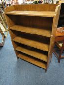AN OPEN OAK WATERFALL BOOKCASE - W 80.5 cm