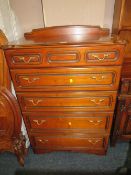 A MODERN FIVE DRAWER CHEST