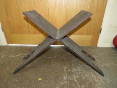 AN EASTERN CARVED HARDWOOD FOLDING SEAT