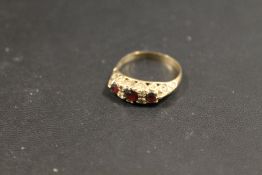 A HALLMARKED 9CT GOLD GARNET DRESS RING - APPROX 2.6 G