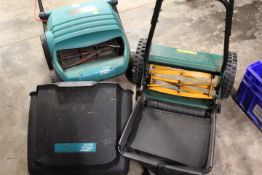 A BOSCH ELECTRIC LAWN MOWER AND A HAND PUSH LAWN MOWER