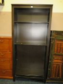 A MODERN FLOORSTANDING OPEN BOOKCASE