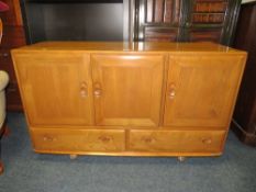 AN ERCOL BLONDE SIDEBOARD - W 129 cm
