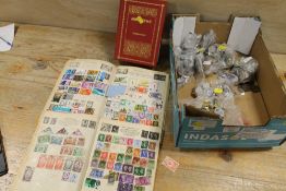 A TRAY OF COLLECTABLES TO INCLUDE STAMPS, COINS AND BADGES
