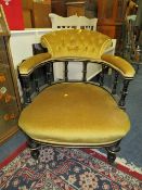AN EDWARDIAN UPHOLSTERED TUB ARMCHAIR