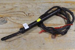 A VINTAGE LEATHER WHIP