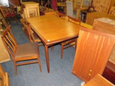 A RETRO TEAK 'E GOMME' FOR G-PLAN EXTENDING DINING TABLE & FOUR CHAIRS