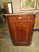 AN ANTIQUE MAHOGANY HANGING CORNER CUPBOARD