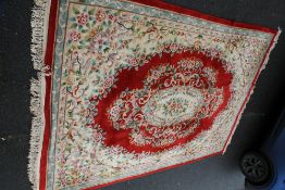A LARGE CHINESE WOOLLEN RUG