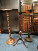 TWO VINTAGE OAK BARLEYTWIST TORCHERES PLUS A MAHOGANY EXAMPLE (3)