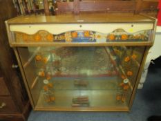 A RETRO CHINA CABINET WITH FLORAL DETAIL