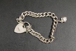 AN ANTIQUE SILVER BRACELET MADE FROM A POCKET WATCH CHAIN